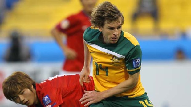 Brett Holman in action against South Korea at the Asian Cup where he showed he has taken the next step as a Socceroo.