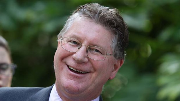 On the bright side: New Premier Denis Napthine is all smiles as he heads to his first news conference in which he denied the state is in recession.