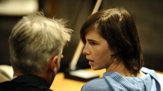 Amanda Knox talks with her lawyer Carlo Dalla Vedova in the Perugia courthouse before the start of her appeal trial.
