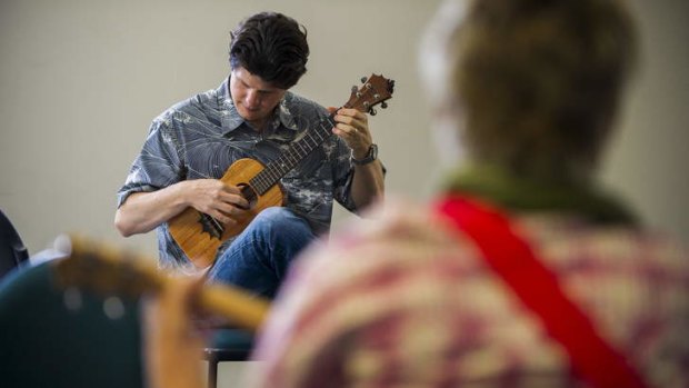 Jeff Peterson from Hawaii teaches a ukulele workshop.