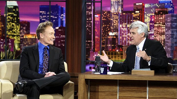 Jay Leno (right) interviews Conan O'Brien, during Leno's final show before O'Brien took over his timeslot.
