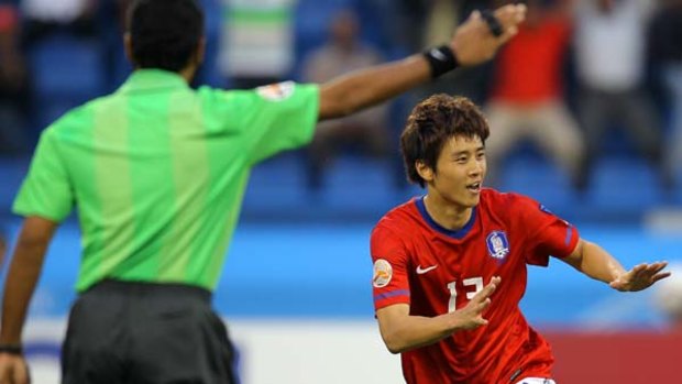 South Korea's midfielder Koo Ja-Cheol celebrates after scoring his team's opening goal.