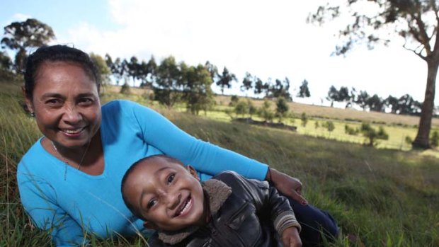Overjoyed: Elsa Sanchez and her son Martinho at the Children First Foundation's farm in Kilmore yesterday.