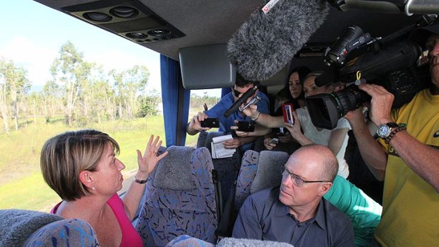Anna Bligh speaks to reporters on her campaign bus after hearing the news of Kevin Rudd's resignation.