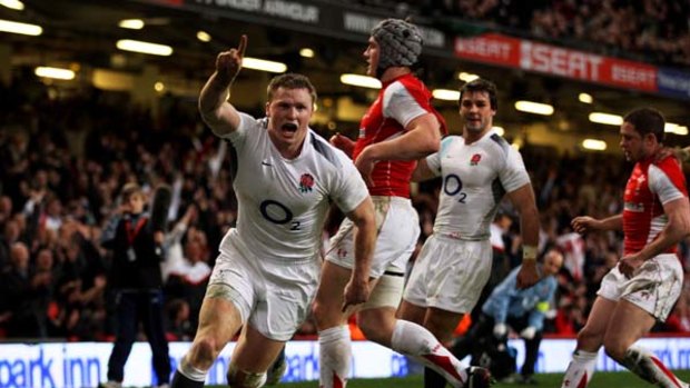 Match winner . . . Chris Ashton of England celebrates after scoring one of his two tries.