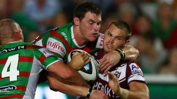 Souths recruit and former Raider Joe Picker makes a tackle against Manly.