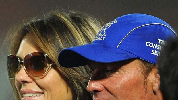 Shane Warne with Liz Hurley after leading the Rajasthan Royals to victory against Kochi in an IPL game last month.