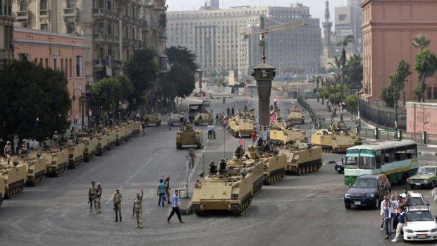 Lockdown: Egyptian soldiers guard an entrance to Tahrir square on Friday.
