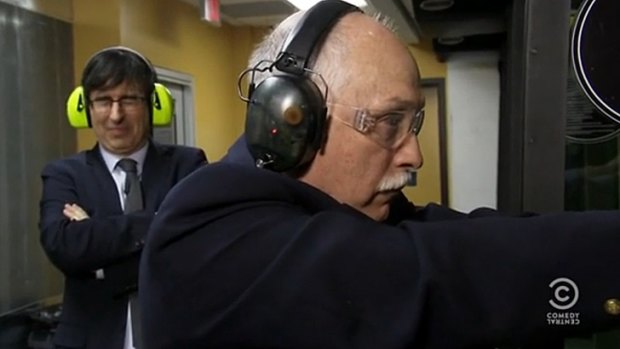 <i>The Daily Show</i> interviewer John Oliver, left, with gun lobbyist Philip Van Cleave.