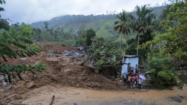 About 150 homes were crushed under mud at about 7.30am, local time.