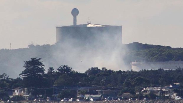 Plumes of smoke rise from a Kurnell water treatment plant.