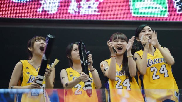 Chinese fans watch the LA Lakers and Golden State Warriors' basketball match during the NBA Global Game 2013 tour at the Mercedes Benz Arena in Shanghai.