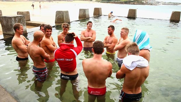 The Sydney Swans during a recovery session at Coogee Beach on Sunday.