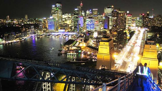 A view of Sydney's glittering lights from the top of Sydney Harbour Bridge.