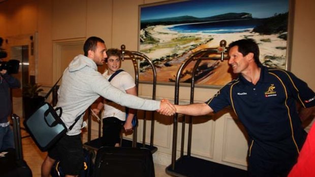 Target ... Robbie Deans, right, greets Quade Cooper at their Coogee hotel yesterday amid rumours the Parramatta Eels are headhunting his star.