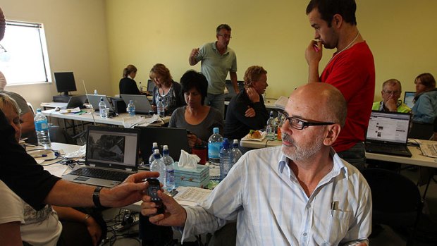 Andrew Holden works in a makeshift newsroom after The Press' Christchurch office was damaged in the 2011 earthqauke.