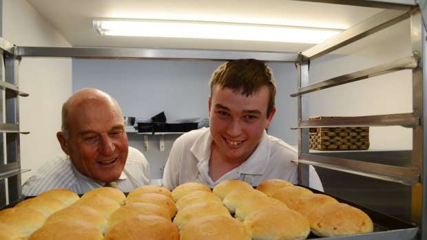 Ballarat Specialist School principal John Burt and apprentice Mark Clough with rolls Mr Clough baked for The Bakery Cafe run by the school.
