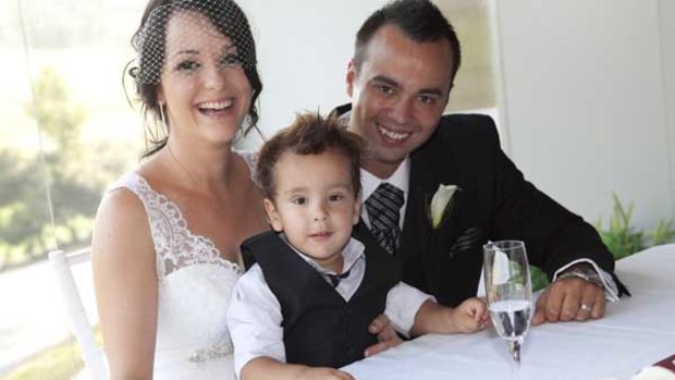 Darren Smith with his wife Angela and son Mason on their wedding day.