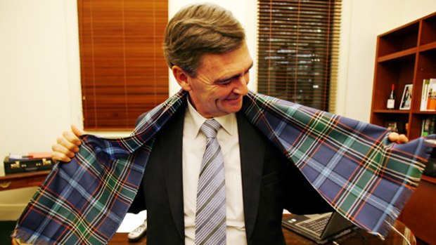 Mr Brumby models the state tartan.