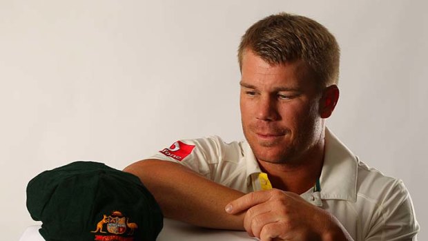 David Warner poses with a baggy green at a portrait session last month.