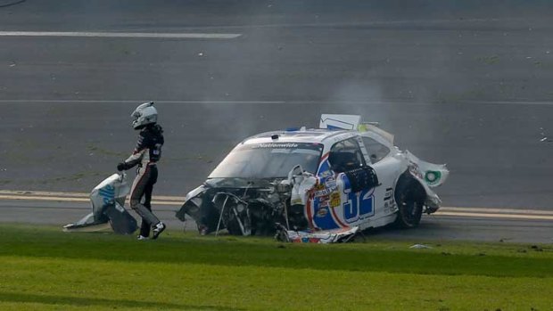 Kyle Larson, driver of the #32 Clorox Chevrolet, gets out of his car.