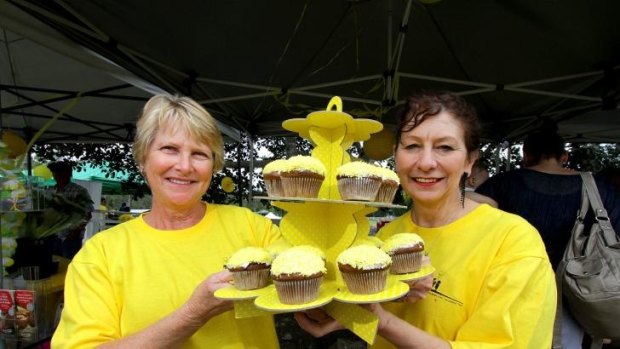 Paula Nokela and Katharine Baynham volunteer at the cupcake and sweets stand.