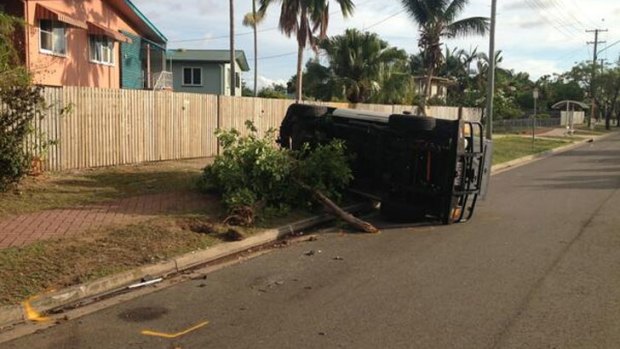The parked four-wheel-drive left overturned at the scene of the crash. Photo: Chris Campey/Ten News, via Twitter.