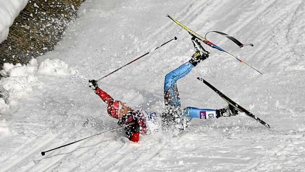 Unlucky break: Russia's Anton Gafarov falls and snaps a ski  during his men's semifinal of the cross-country sprint.
