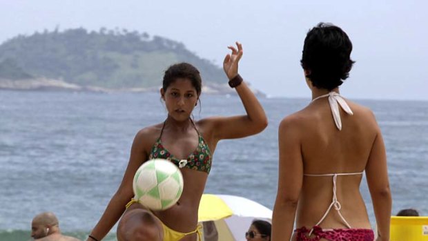 Sun and soccer ... football on Rio de Janeiro's iconic Ipanema Beach.