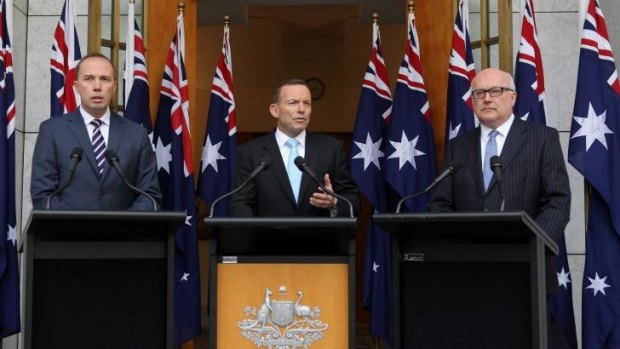 Immigration Minister Peter Dutton, Prime Minister Tony Abbott and Attorney-General Senator George Brandis at a press conference the day after Mallah appeared on <i>Q&A</i>.