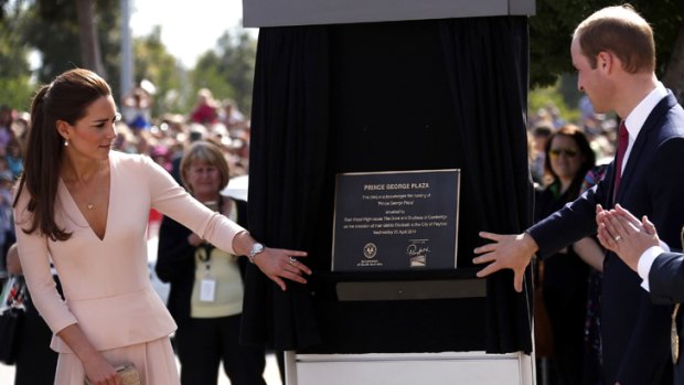 The Duke and Duchess unveil a plaque renaming a plaza in Elizabeth in honour of their son.