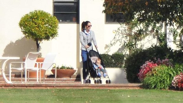 Kate and Prince George enjoy a bit of sun and a stroll at Government House, Yarralumla, Canberra, on Monday.