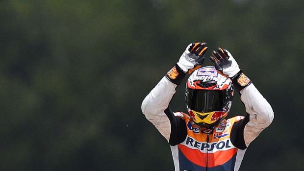 Victory ... Casey Stoner celebrates after winning the Portugal MotoGP Race in Estoril on May 6.