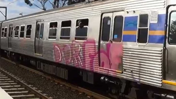The graffiti on the side of the train.