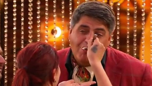 Tregan feeds Matt Preston a spoonful of her dish.