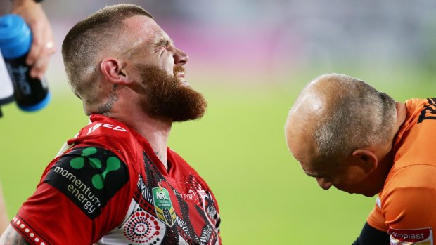 Josh Dugan of the Dragons after injuring his elbow against the Rabbitohs on Thursday night.