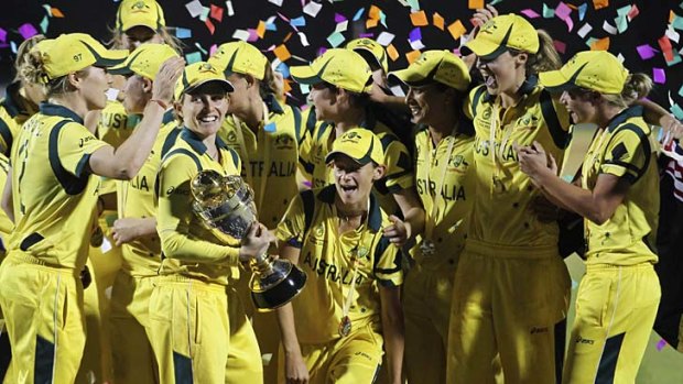 Champions ... Australia celebrate with the trophy after winning the ICC Women's cricket World Cup in Mumbai.