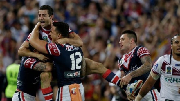 Roosters players celebrate during last year's grand final win over Manly.