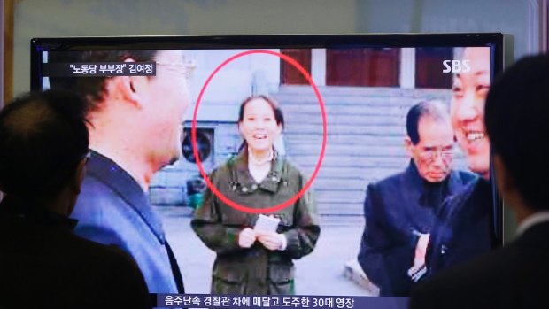 South Koreans watch a TV news program showing Kim Yo-jong, North Korean leader Kim Jong-un's younger sister, in 2014.