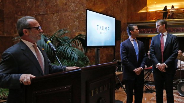 Eric Danziger, head of Trump's hotels division, with Donald Trump Jr, centre, and Eric Trump, right, at an event to launch "American Idea", a new mid-market hotel chain last week.