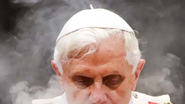 Incense smoke surrounds Pope Benedict XVI as he leads a solemn mass in Saint Peter's Basilica at the Vatican January 1, 2010.