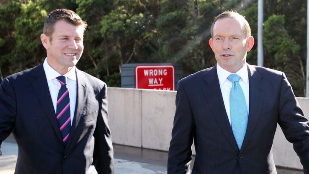 "Watching events as they unfold": Mike Baird and Tony Abbott meet to sign a WestConnex motorway funding agreement following the federal budget.