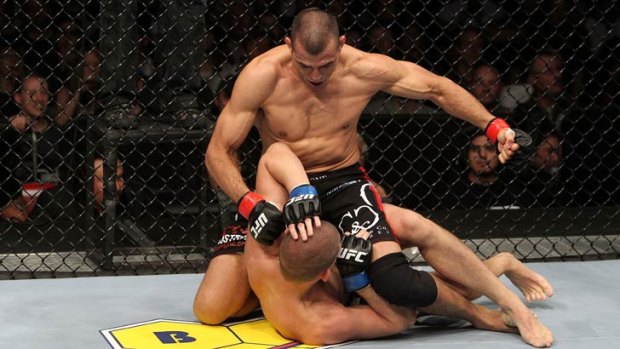 George Sotiropoulos (top) pounds his way to a UFC victory over Joe Lauzon in November, 2010.