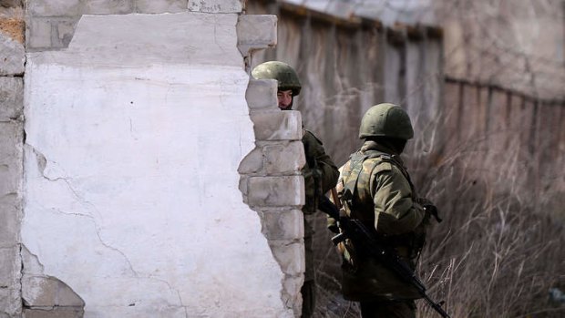 Keeping guard: Russian troops outside a military base in Ukraine.