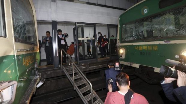 Windows of two subway trains remain broken after their collision at Sangwangshipri subway station in Seoul on Friday.