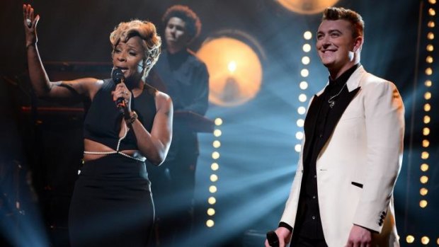 Mary J. Blige and Sam Smith perform at New York City's Apollo theatre.
