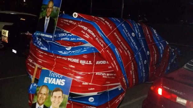 Member-elect for Brisbane Trevor Evans's brothers wrapped his car in election material at the height of Saturday night's celebrations.
