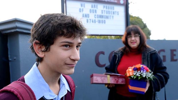 William Mack and his mother, Andrea Mack, bring gifts for some of the teachers on the final day at Mowbray College in Melton.