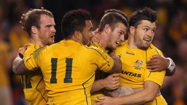 The Wallabies celebrate Rob Horne's try at the end of the first half.