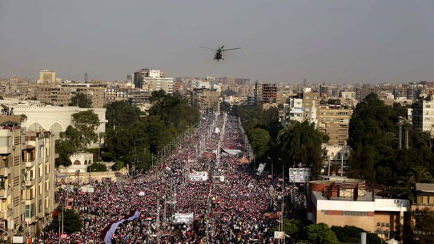 A military helicopter files over the presidential palace in Cairo.
